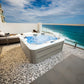 Jacuzzi Hydra 200 en una terraza con vistas al mar.